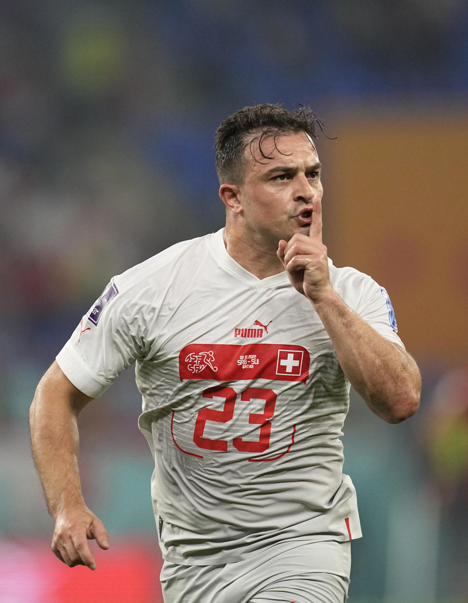 Switzerland's Xherdan Shaqiri celebrates after scoring his side's opening goal during the World Cup group G soccer match between Serbia and Switzerland, at the Stadium 974 in Doha, Qatar, Friday, Dec. 2, 2022. (AP Photo/Ebrahim Noroozi)