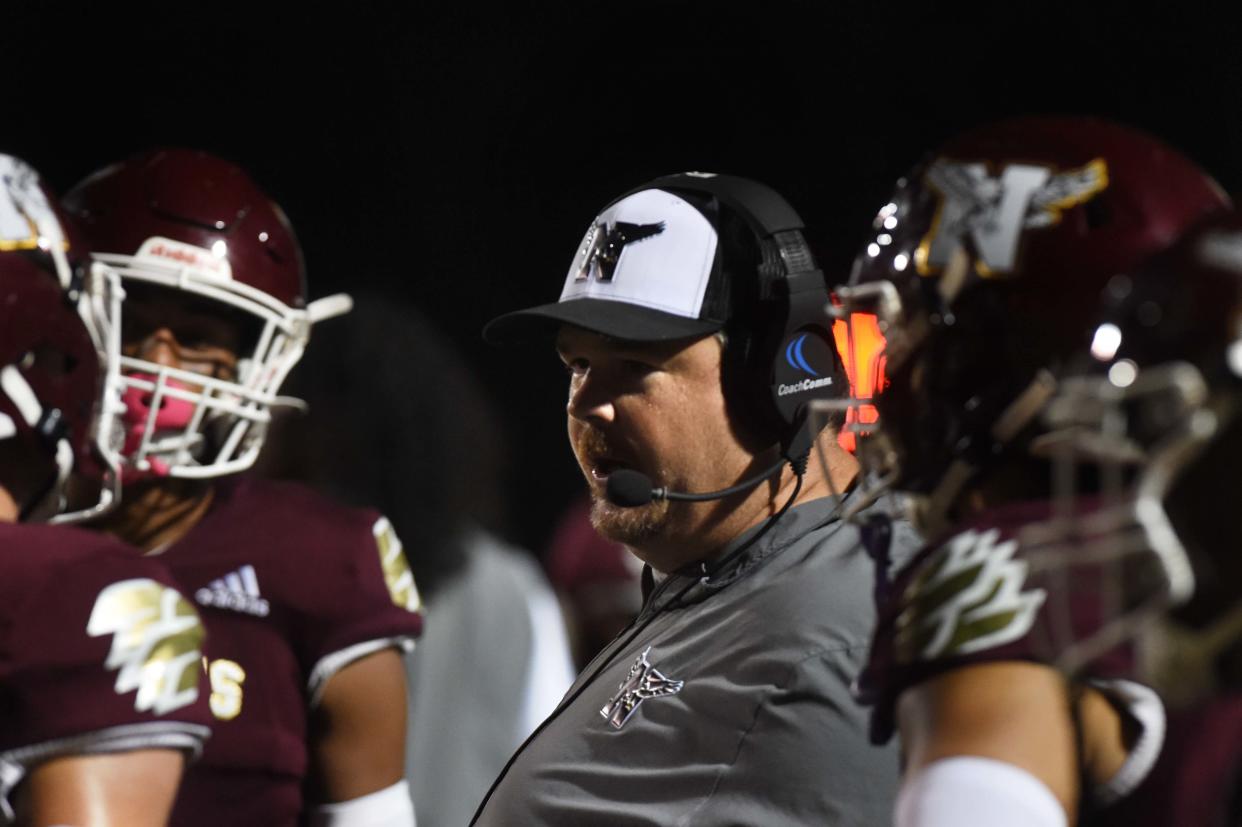 Niceville High School Football Coach Grant Thompson talks to his team during Friday night's game at Niceville.