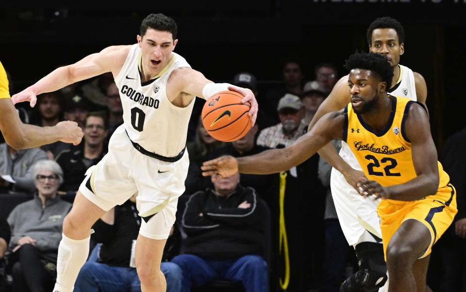 Colorado forward Luke O'Brien chases down a ball with California forward ND Okafor dur5ing an NCAA college basketball game Thursday, Feb. 2, 2023, in Boulder, Colo.(AP Photo)