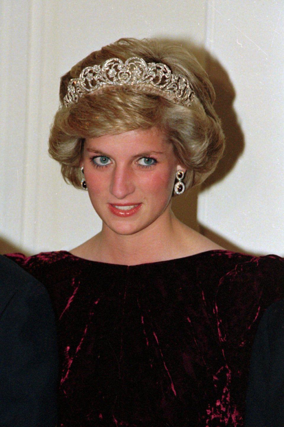 Britain's Princess Diana wears the Spencer tiara as she and Prince Charles attend state dinner at Government House in Adelaide, Austraila, Nov. 7, 1985. (AP Photo/Jim Bourdier)