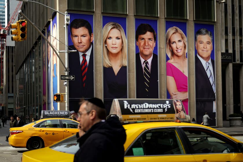 NEW YORK, NY - MARCH 13: Traffic on Sixth Avenue passes by advertisements featuring Fox News personalities, including Bret Baier, Martha MacCallum, Tucker Carlson, Laura Ingraham, and Sean Hannity, adorn the front of the News Corporation building, March 13, 2019 in New York City. On Wednesday the network's sales executives are hosting an event for advertisers to promote Fox News. Fox News personalities Tucker Carlson and Jeanine Pirro have come under criticism in recent weeks for controversial comments and multiple advertisers have pulled away from their shows. (Photo by Drew Angerer/Getty Images)