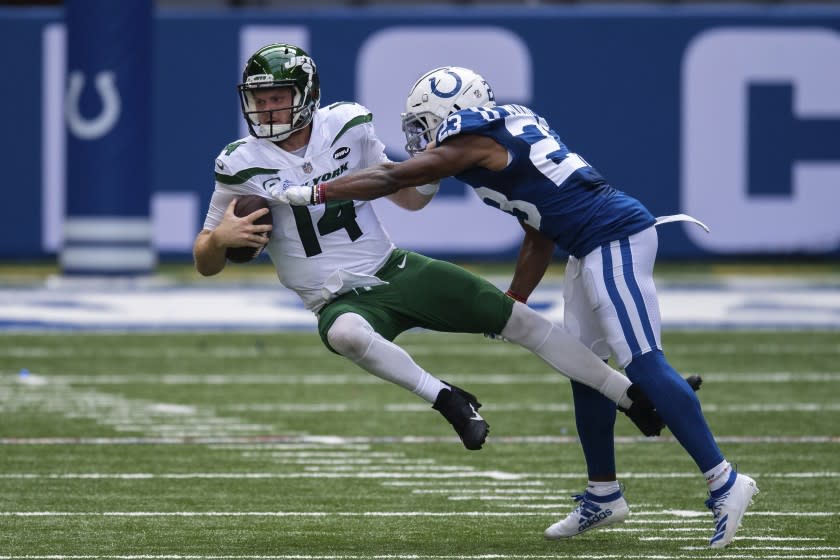 Indianapolis Colts cornerback Kenny Moore (23) sacks New York Jets quarterback Sam Darnold (14) during an NFL football game between the Indianapolis Colts and New York Jets, Sunday, Sept. 27, 2020, in Indianapolis. (AP Photo/Zach Bolinger)