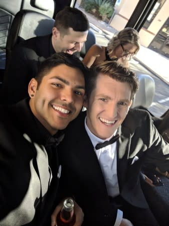 Blake Coelho and Matthew Fernando pose on a party bus as they head to their wedding