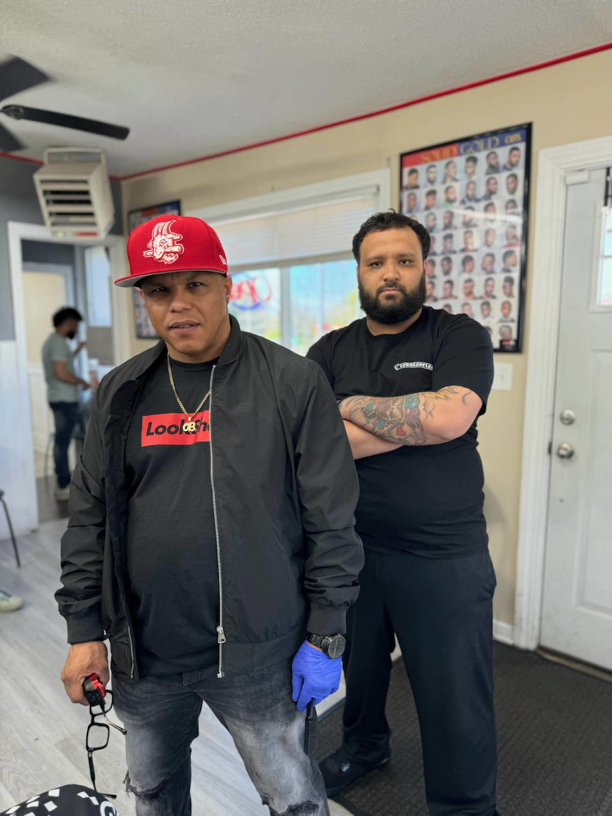 Barbershop owner Osvaldo Lugo, left, and barber Rafael Santana. (Courtesy Rafael Santana)