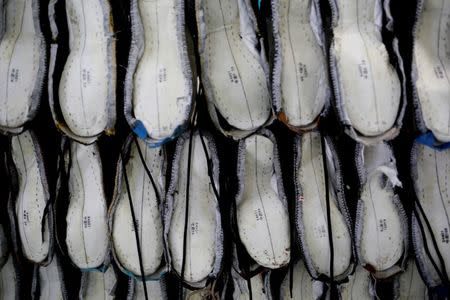 Shoes are being made at Complete Honour Footwear Industrial, a footwear factory owned by a Taiwan company, in Kampong Speu, Cambodia, July 4, 2018. REUTERS/Ann Wang