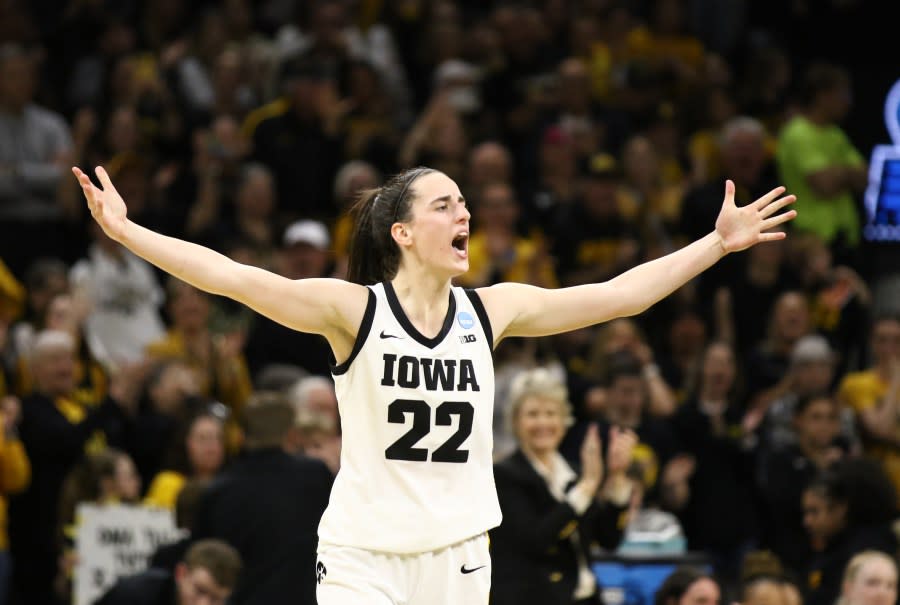 IOWA CITY, IOWA- MARCH 25: Guard Caitlin Clark #22 of the Iowa Hawkeyes celebrates after drawing a foul late in the second half against the West Virginia Mountaineers during their second round match-up in the 2024 NCAA Division 1 Women’s Basketball Championship at Carver-Hawkeye Arena on March 25, 2024 in Iowa City, Iowa. (Photo by Matthew Holst/Getty Images)