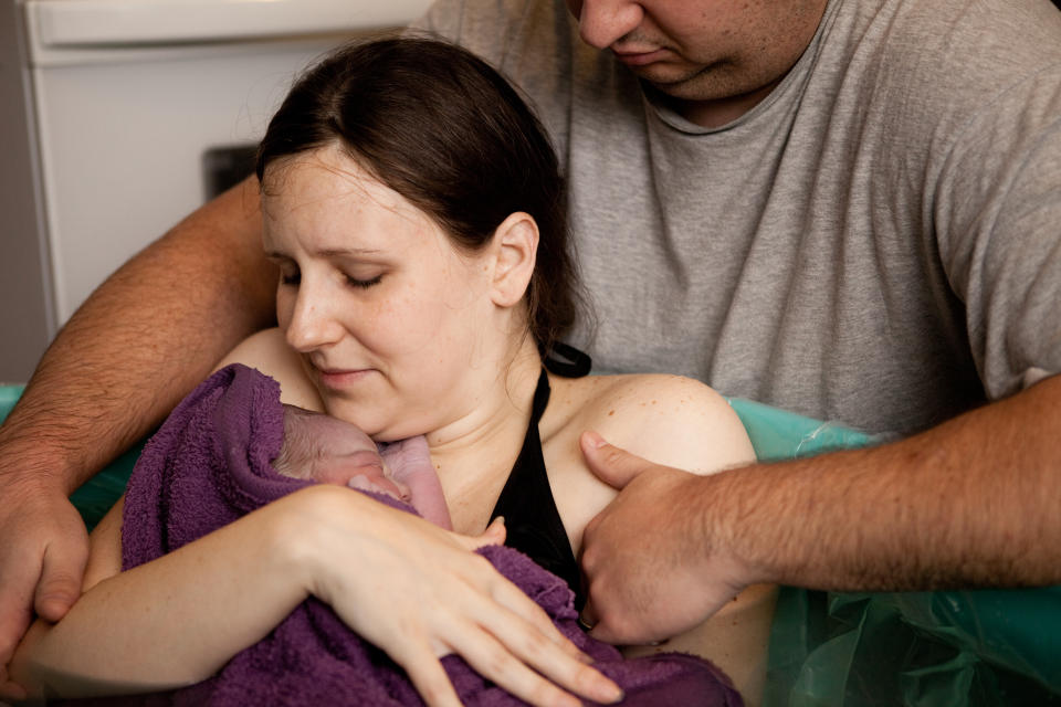 Woman and man during water birth. (Getty Images)