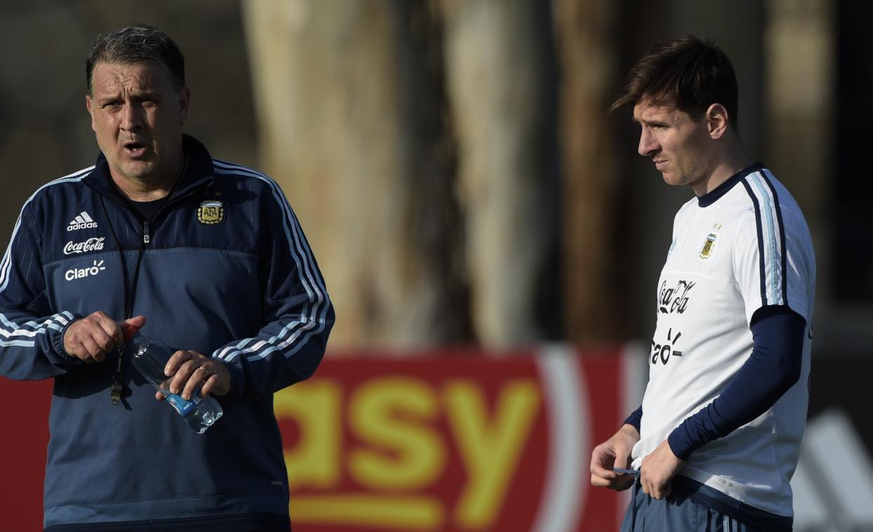 Argentina's forward Lionel Messi (R) listens to coach Gerardo Martino during a training session in La Serena, Coquimbo, Chile, on June 23, 2015 ahead the Copa America quarterfinal football match against Colombia to be held in Vina del Mar on June 26. AFP PHOTO / JUAN MABROMATA / AFP / Juan MABROMATA        (Photo credit should read JUAN MABROMATA/AFP via Getty Images)