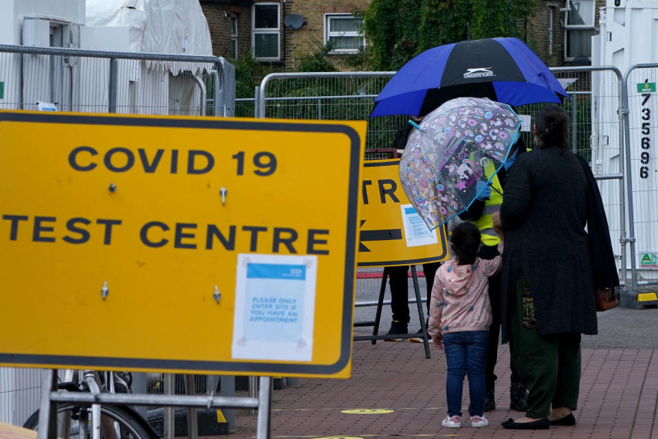 LONDON, ENGLAND - SEPTEMBER 23: People queue outside a COVID-19 testing centre in Walthamstow on September 23, 2020 in London, England. Cases have risen to 5000 per day, and are at their highest since the height of lockdown in May.  (Photo by Mark Case/Getty Images)