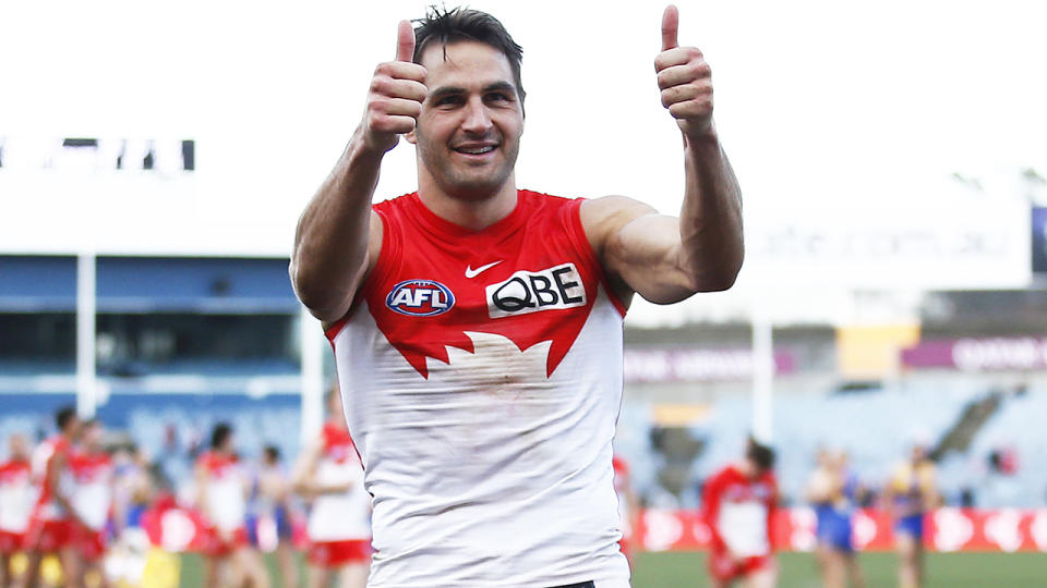 Sydney Swans midfielder Josh Kennedy gives fans a thumbs up as he walks from the field.