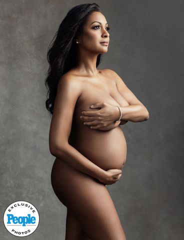 <p>Lola Melani Photography</p> Eboni K. Williams channels Demi Moore's infamous 'Vanity Fair' cover while stripping down to show off her pregnancy body
