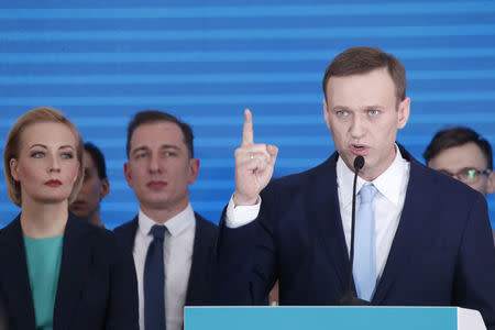 Russian opposition leader Alexei Navalny and his wife Yulia attend a meeting to uphold his bid for presidential candidate, in Moscow, Russia December 24, 2017. REUTERS/Maxim Shemetov TPX IMAGES OF THE DAY