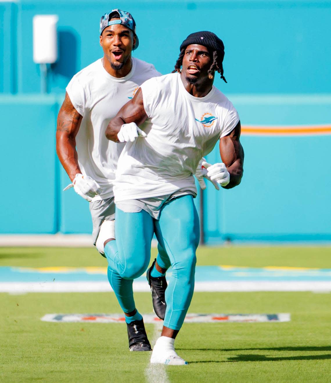 Miami Dolphins wide receivers Jaylen Waddle (17) and Tyreek Hill (10) practice before the start of an NFL preseason football game against the Philadelphia Eagles at Hard Rock Stadium on Saturday, August 27, 2022 in Miami Gardens, Florida.