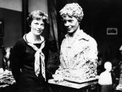 Mrs. Amelia Earhart Putnam pictured beside a likeness of herself executed by George Conlon, an American sculptor now living in Paris in an undated photo. The bust which is remarkable facsimile of the transatlantic flier was modeled almost entirely with the aid of photographs because of the inability of the flier to devote most of her time while in Paris to the sittings. (AP Photo)