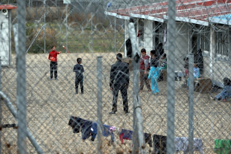 Children play outside the Filakio detention centre for migrants and refugees near the Greek-Turkish border