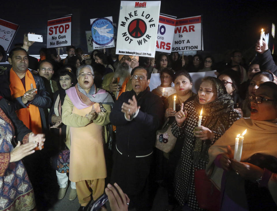 Members of the civil society group, Citizens of Lahore, participate in a candlelit vigil against war, in Lahore, Pakistan, Sunday, March 3, 2019. Residents near the disputed boundary in divided Kashmir region said Sunday it was quiet overnight, their first lull since a dangerous escalation between Pakistan and India erupted last week bringing the two nuclear-armed rivals close to full-out war. (AP Photo/K.M. Chaudary)