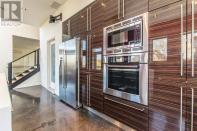 <p><span>7 Palmer Hill Rd., Halifax, N.S.</span><br> Here’s a look at the fridge and oven, built into the wall.<br> (Photo: Zoocasa) </p>