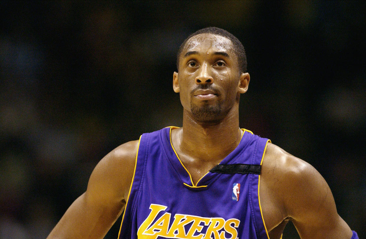 Kobe Bryant of the Los Angeles Lakers looks at the clock during a game against the New Jersey Nets