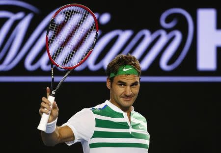 Switzerland's Roger Federer reacts after winning his third round match against Bulgaria's Grigor Dimitrov at the Australian Open tennis tournament at Melbourne Park, Australia, January 22, 2016. REUTERS/Thomas Peter