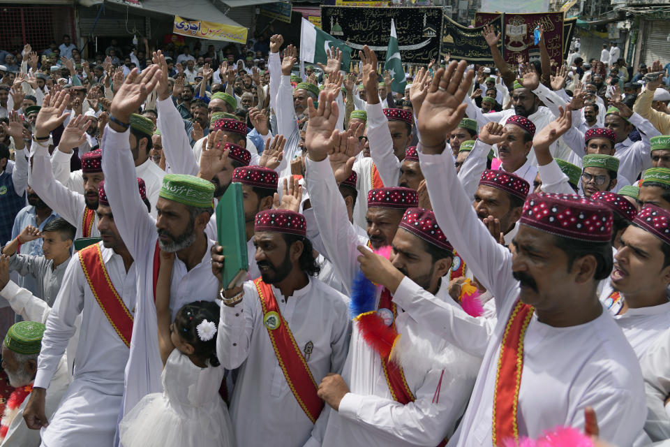 Muslims chant religious slogans during a rally celebrating the birthday of Islam's Prophet Muhammad, in Rawalpindi, Pakistan, Friday, Sept. 29, 2023. Thousands of Muslims take part in religious processions, ceremonies and distributing free meals among the poor to mark the holiday. (AP Photo/Anjum Naveed)