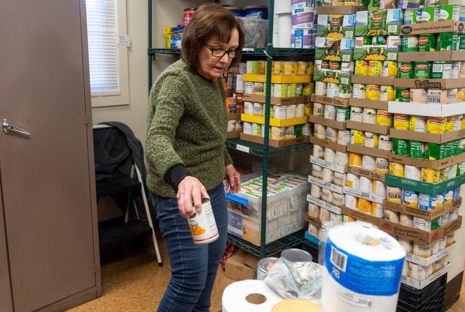 Nancy Sclight, from Richboro, gets canned food and goods together at the Warminster food bank in Warminster on Monday, Nov. 20, 2023.

[Daniella Heminghaus | Bucks County Courier Times]