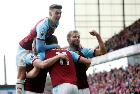Soccer Football - Premier League - Burnley v Cardiff City - Turf Moor, Burnley, Britain - April 13, 2019 Burnley's Chris Wood celebrates scoring their second goal with Charlie Taylor and Matthew Lowton REUTERS/Andrew Yates