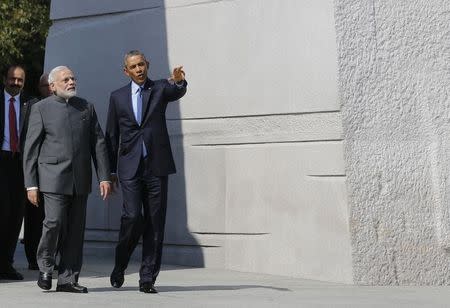 U.S. President Barack Obama and India's Prime Minister Narendra Modi walk together at the National Martin Luther King Memorial on the National Mall in Washington September 30, 2014. REUTERS/Larry Downing/Files