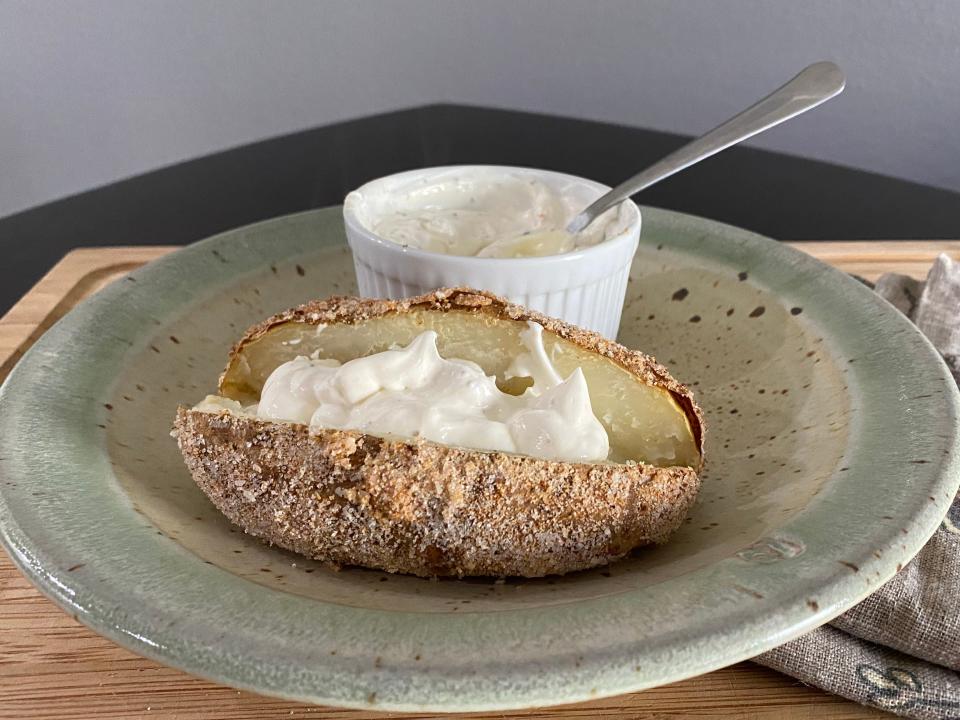 completed guy fieri baked potato recipe with horseradish sour cream