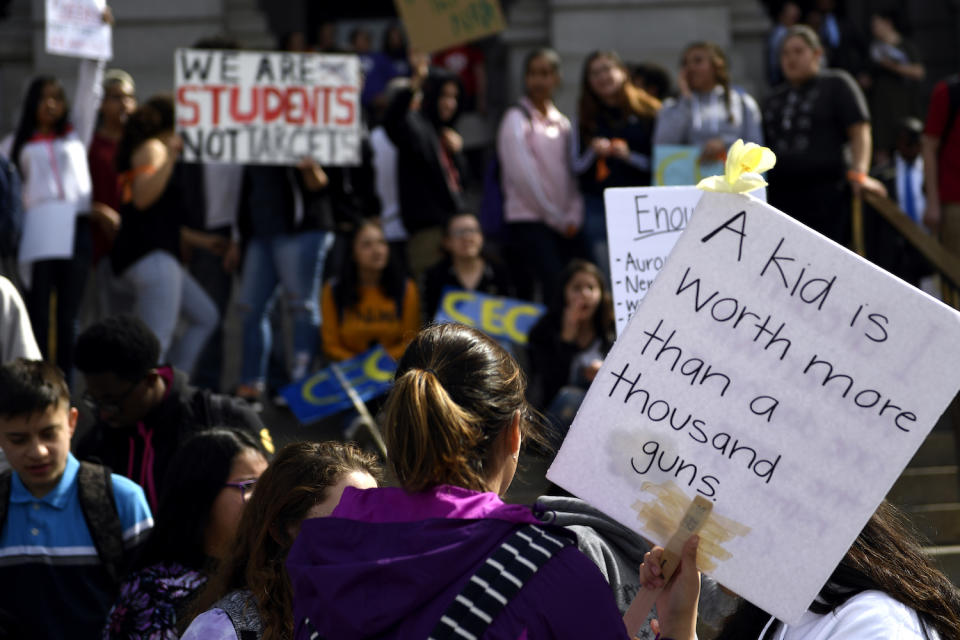 <p>High school students at the Denver State Capitol take part in a national walkout to protest gun violence. (Photo: Getty Images) </p>