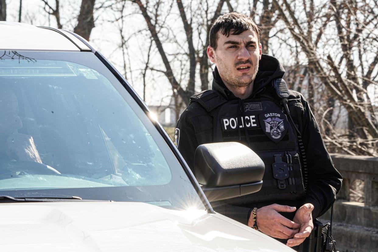 EPD Officer and founder of "A Voice For Kids," foster care and child abuse advocate Matthew Peiffer, searches with volunteers along the river near the intersection of Eaton-Wheeling Pike and Walnut St. for missing child Scottie Dean Morris, in Eaton Ind. on Monday March 20, 2023. Peiffer is currently running as a Republican in the 5th Congressional District's 2024 primary.