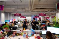 Employees work at AliExpress office at the Alibaba company's headquarters in Hangzhou