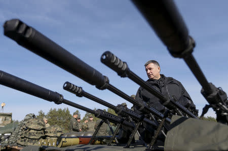 FILE PHOTO: Ukraine's Interior Minister Arsen Avakov stands next to Barrett sniper rifles before a military drill near the village of Stare in Kiev region, Ukraine, October 2, 2015. REUTERS/Valentyn Ogirenko/File Photo