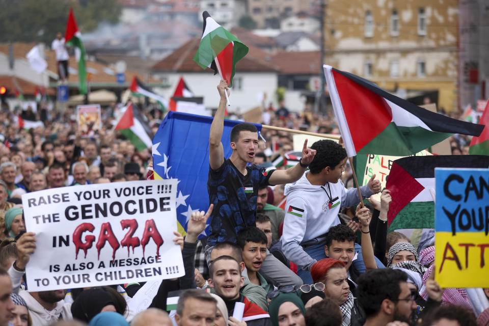 A Bosnian man waves a Palestinian flag and during a protest against Israel and in support of Palestinians in Sarajevo, Bosnia, Sunday, Oct. 22, 2023. (AP Photo/Armin Durgut)