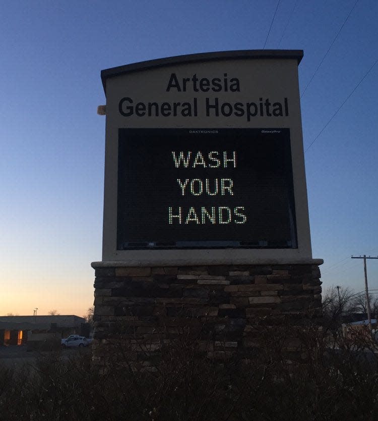 A sign at Artesia General Hospital during the early morning of Jan. 24, 2021 reminds people to wash their hands in order to fight COVID-19 in Eddy County.
