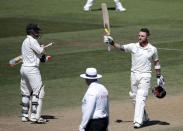 New Zealand's Brendon McCullum (R) acknowledges his 200 against India during the second innings on day four of the second international test cricket match at the Basin Reserve in Wellington, February 17, 2014.