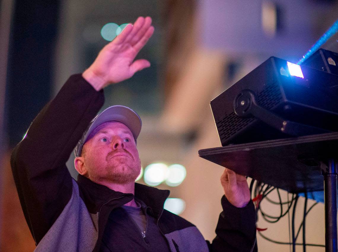 Nu-Salt Laser owner Tim Anderson, the man who created the system used for the Sacramento Kings roof-mounted laser beam, sets up the lasers outside Golden 1 Center on Wednesday, Nov. 30, 2022.