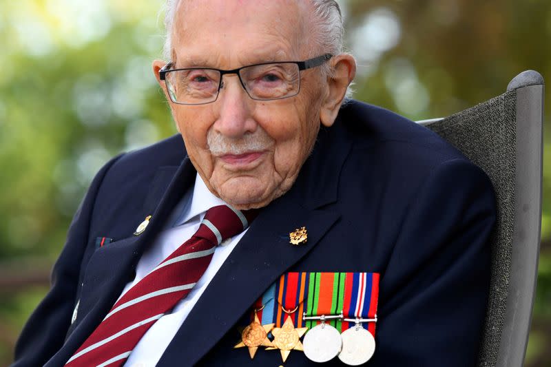 FILE PHOTO: Captain Sir Tom Moore smiles as he launches his autobiography book at his home in Milton Keynes