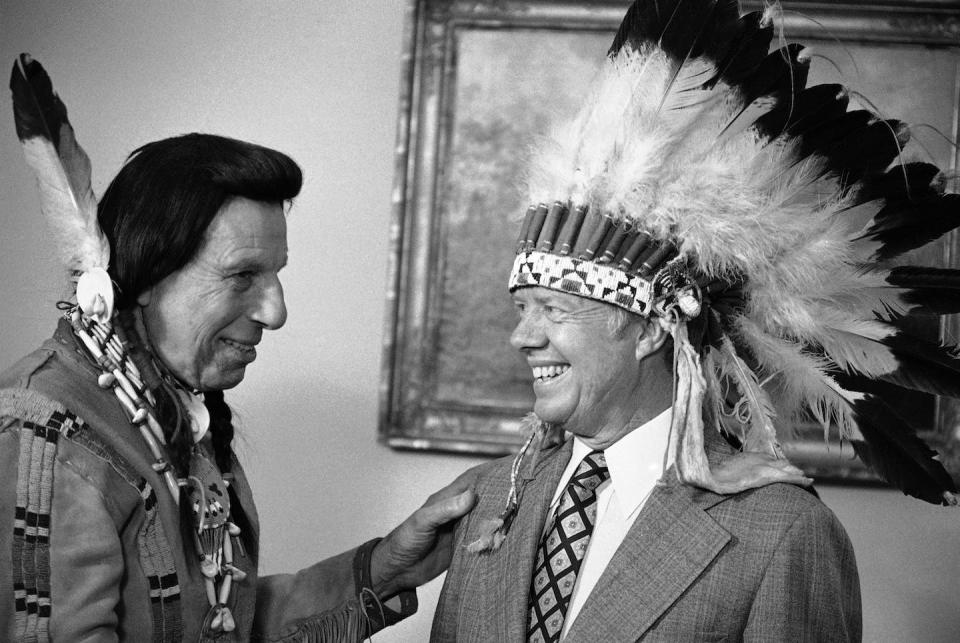 Actor Iron Eyes Cody, left, with President Jimmy Carter in 1978, built a decadeslong career on pretending to be Cherokee. He was of Italian descent. <a href="https://newsroom.ap.org/detail/PresidentJimmyCarter/3d92ef7915994a5bb0c704f0e37dc36e/photo?Query=Iron%20eyes%20cody&mediaType=photo&sortBy=arrivaldatetime:desc&dateRange=Anytime&totalCount=4&currentItemNo=1" rel="nofollow noopener" target="_blank" data-ylk="slk:AP Photo/Peter Bregg;elm:context_link;itc:0;sec:content-canvas" class="link ">AP Photo/Peter Bregg</a>