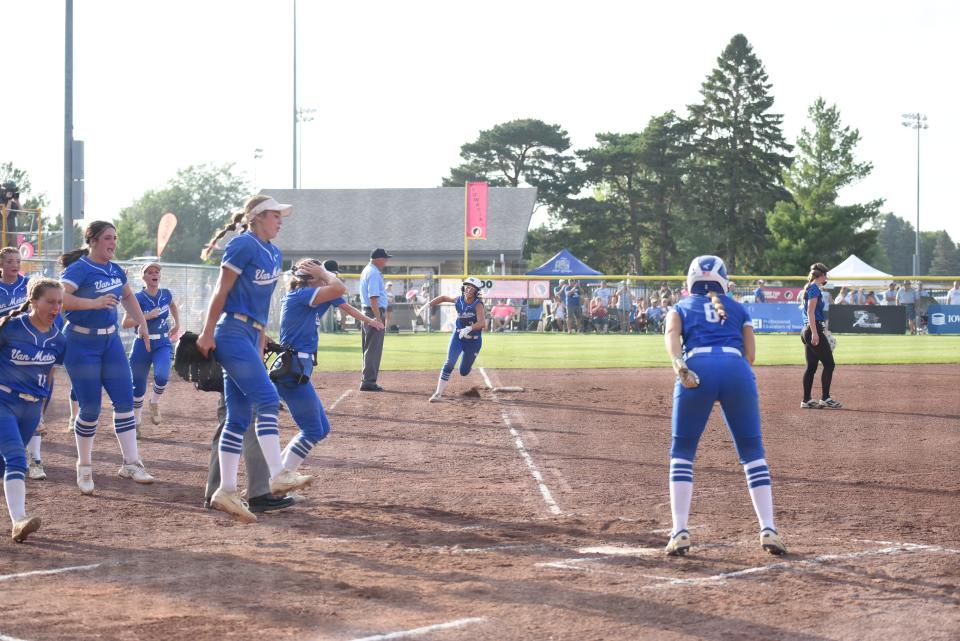 Van Meter's Lauren Wallace runs home after Macy Blomgren's home run in the first inning of the Class 2A semifinal game against Central Springs.