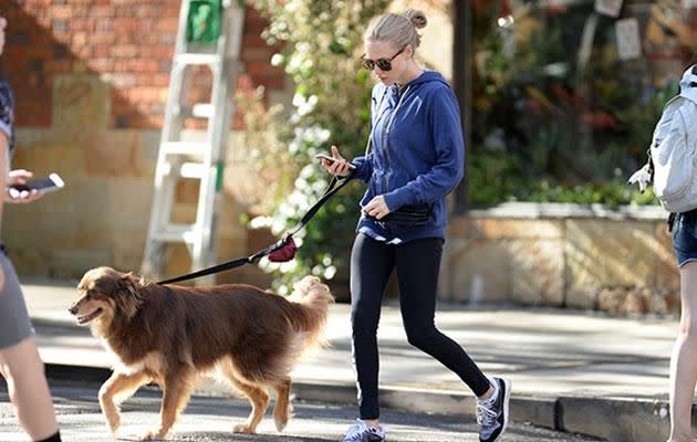 Amanda showed off her ring as she walked her dog. Source: Splash