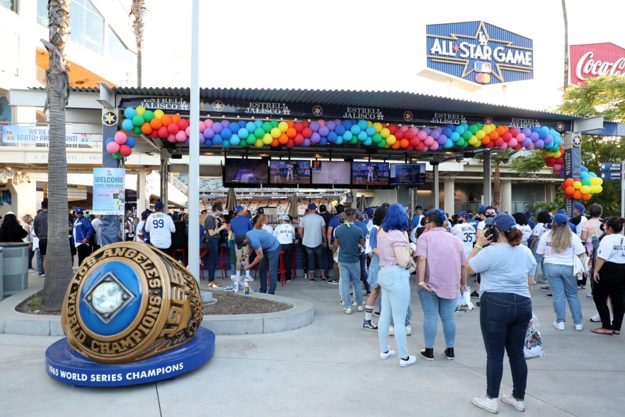 Fans attend LGBTQ+ Pride Night at Dodger Stadium in June 2021.