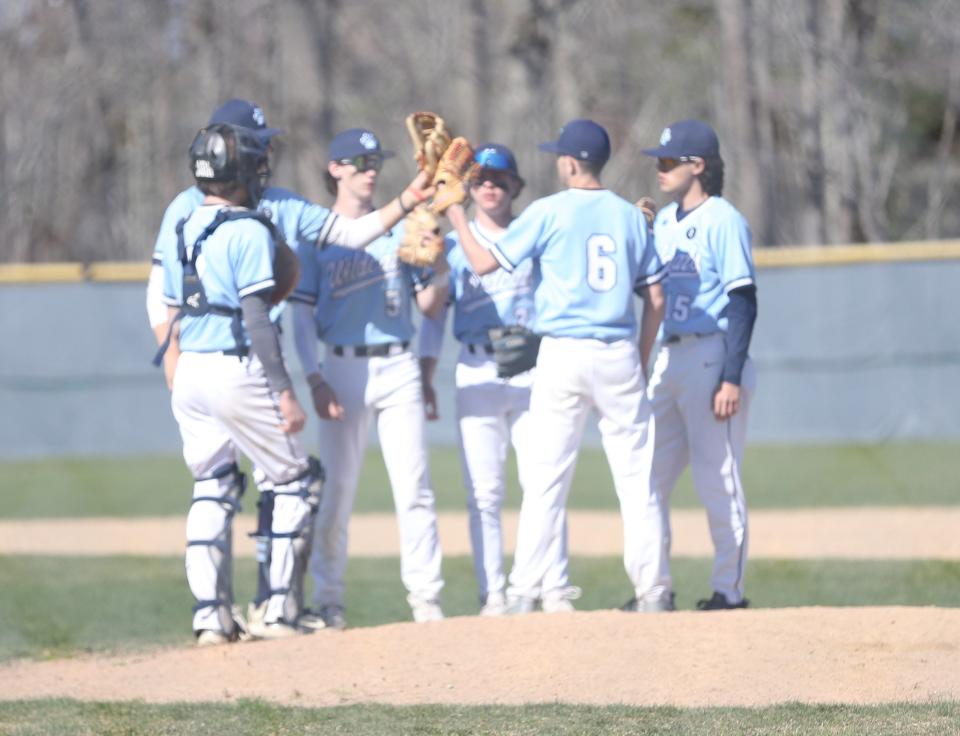 Members of the York High School baseball team celebrate after an 8-4 season-opening win over Fryeburg Academy on Thursday.