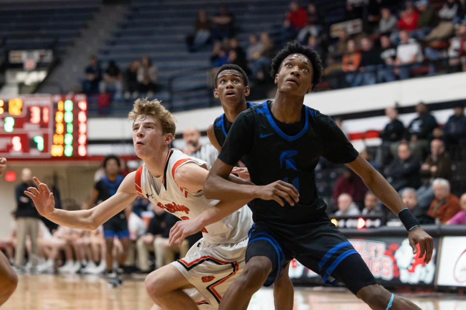 Dalton sophomore Brady Hignight and Richmond Heights sophomore Dorian Jones battle for position for a rebound during the Division IV Regional Final game at the Canton Memorial Fieldhouse, March 10, 2023.