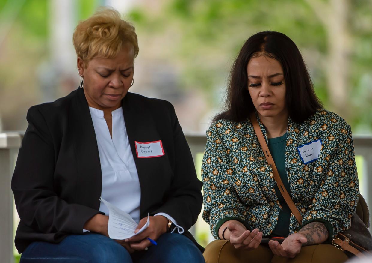 April Crawl, First Lady at Second Baptist Church in Rochester, left, and Christyn Gilliam, program coordinator from Church in the Round, Aliquippa, pray together Thursday during a celebration of National Day of Prayer & Unity Prayer at the Gazebo in Irvine Park, Beaver.