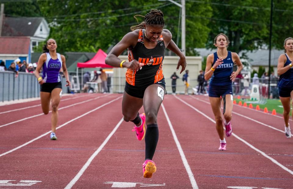 West Warwick's Xenia Raye wins the girls 400-meter race at last spring's championship meet.