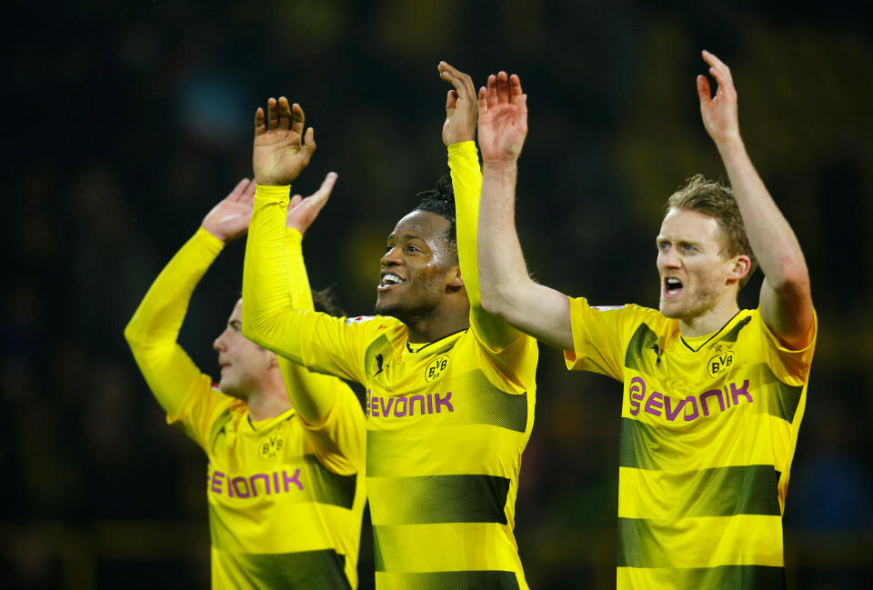 Michy Batshuayi celebrates with teammates after Dortmund’s victory over Hamburg