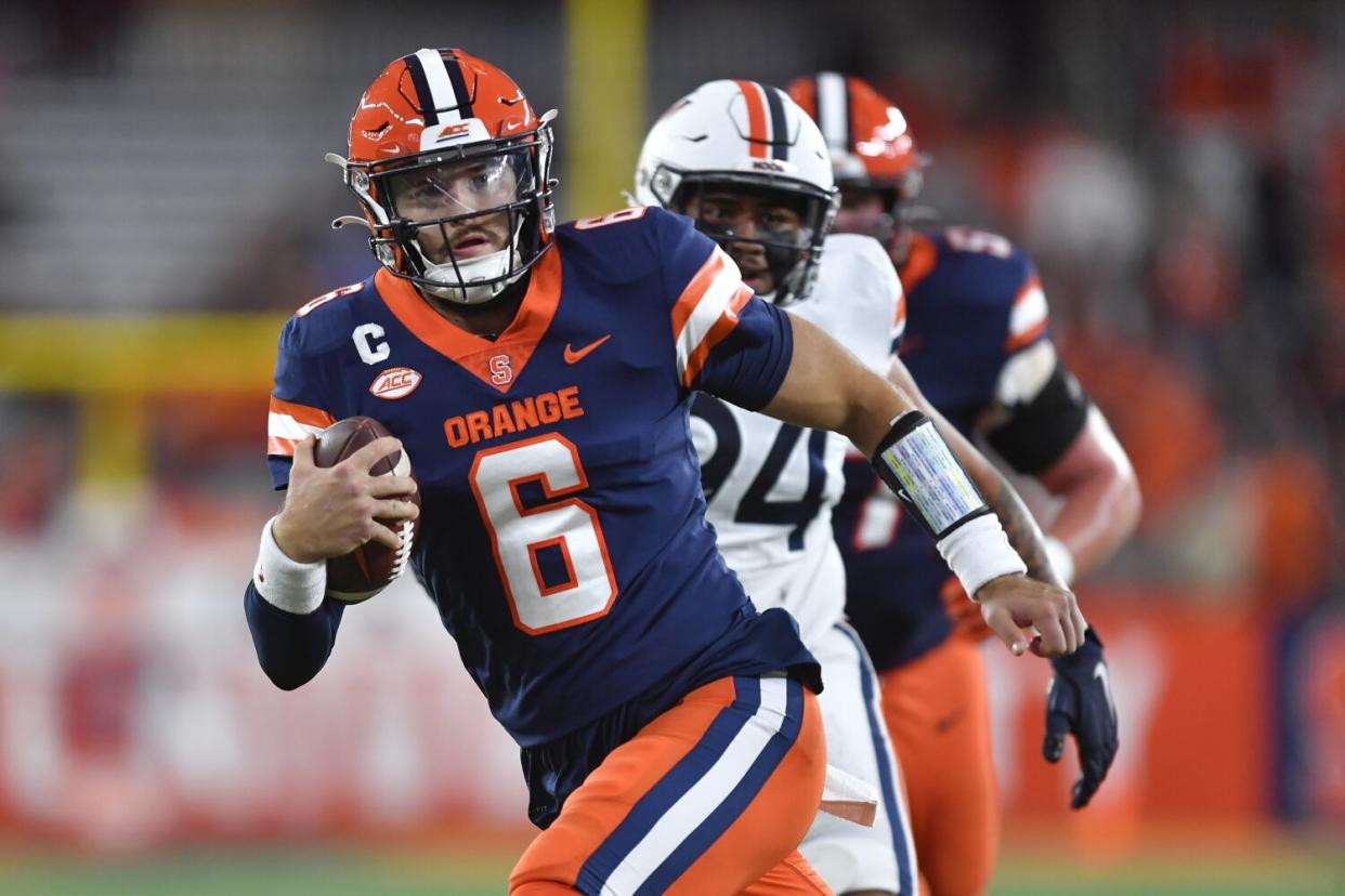 Syracuse quarterback Garrett Shrader runs for a touchdown against Virginia on Sept. 23.