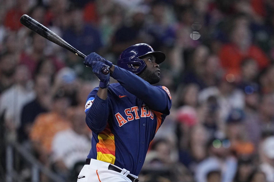 Houston Astros' Yordan Alvarez hits an RBI sacrifice fly during the sixth inning of a baseball game against the San Diego Padres, Sunday, Sept. 10, 2023, in Houston. (AP Photo/Kevin M. Cox)