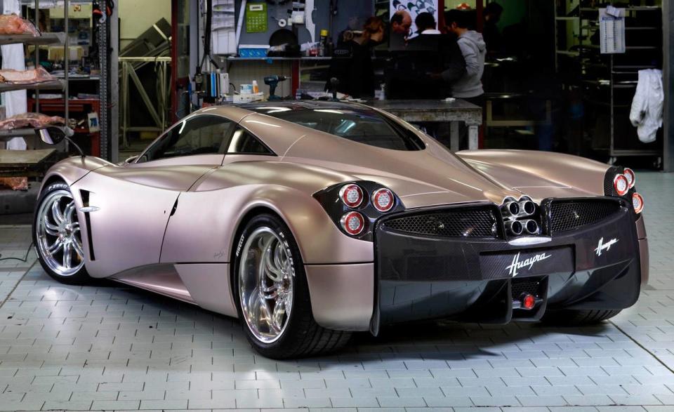 <p>The Huayra uses a similar quad-pipe setup as the Zonda, but the Huayra's is even more special; the top portion of the exhaust is incorporated into the car's body design. Plus if you look closely enough, you can see the pipes snaked behind the mesh engine shroud out back. </p>