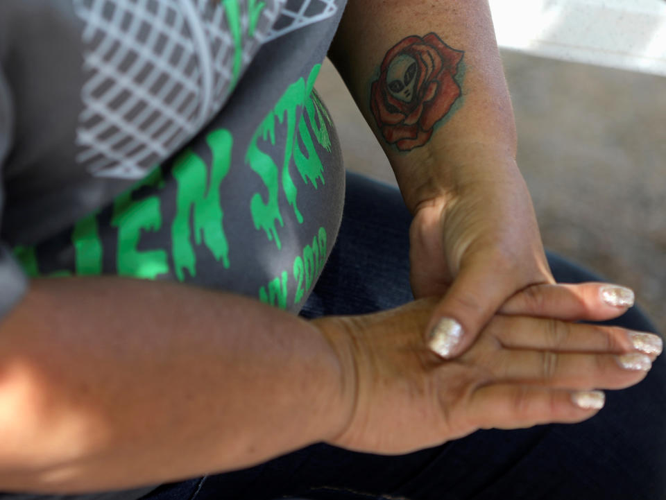 An alien themed tattoo on Little A'Le'Inn proprietor Connie West as she talks about preparations as an influx of tourists responding to a call to 'storm' Area 51, a secretive U.S. military base believed by UFO enthusiasts to hold government secrets about extra-terrestrials, is expected in Rachel, Nevada, Sept. 19, 2019. (Photo: Jim Urquhart/Reuters)